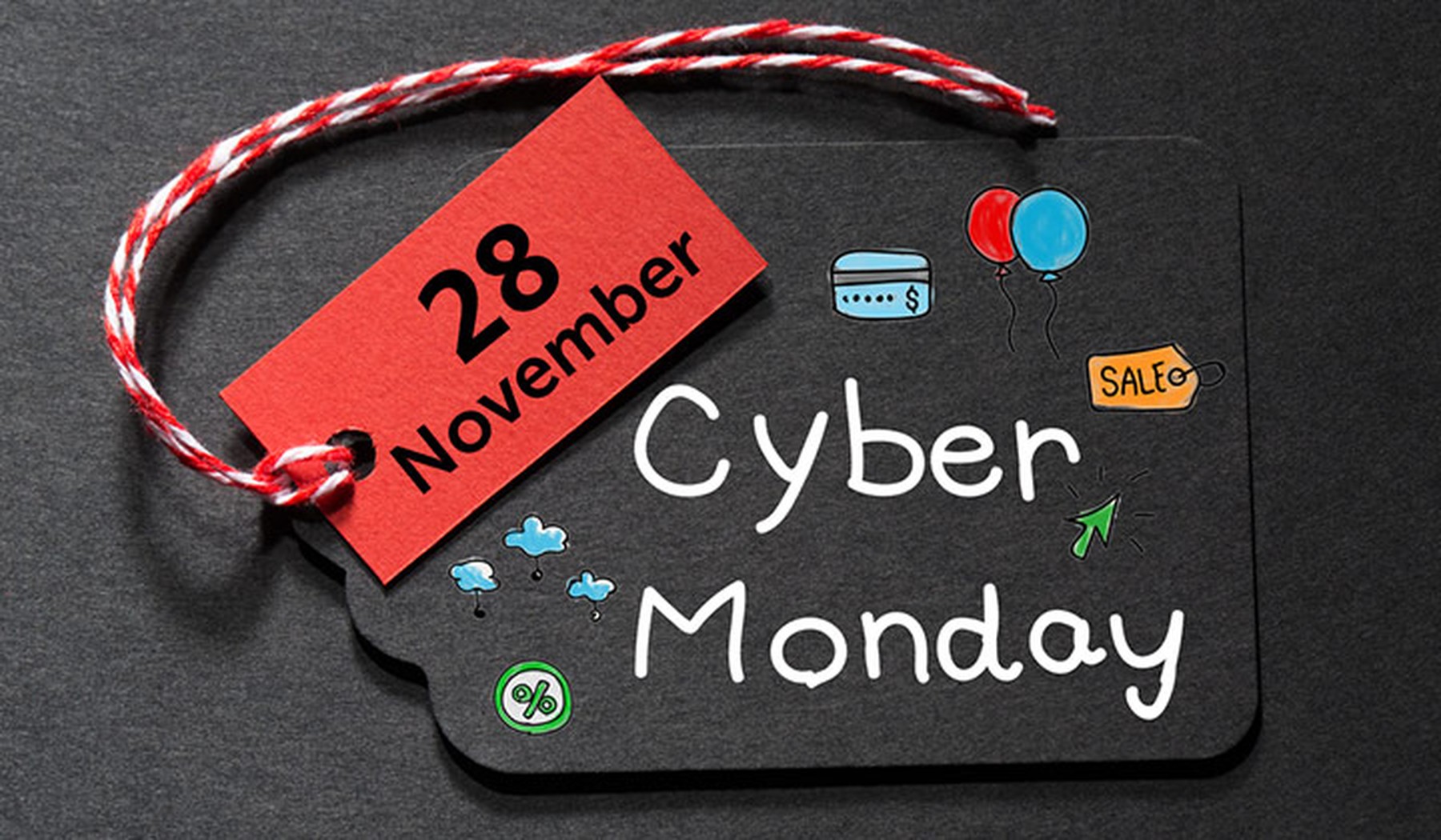 Etiqueta negra de Cyber Monday con dibujos y otra etiqueta roja con 28 November escrito